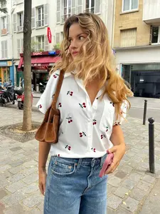 A women's white short-sleeve shirt with cherry prints, featuring a fresh and sweet casual style, perfect for relaxed and enjoyable casual settings like daily street strolls, coffee afternoon tea, or weekend gatherings with girlfriends, Casual Classy Top