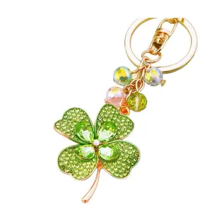 Four-Leaf Clover for Good Luck. Shiny Four Leaf Clover Keychain with Sparkling Beads and Gold Tone Ring for Stylish Accessory