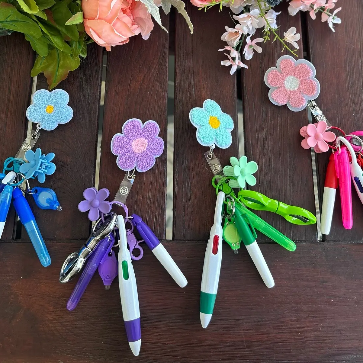 Badge Reel (Flowers or Bow) with Accessories Mini Highlighter, Marker, Retractable multicolor Pen, Nursing Keychain Clip, and LED Flashlight Keychains badgereels great gift