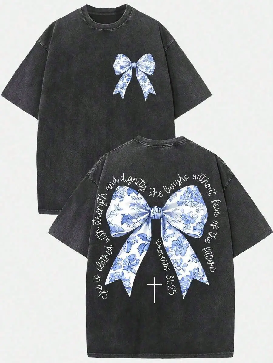 Vintage Proverbs 31:25 Blue Floral Bow Front Back Christian T-Shirt, Washed Black Oversized Cotton Crewneck Tee, She Is Clothed With Strength And Dignity Cross Religious Faith Gift Top For Women Believers
