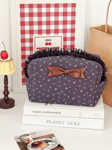 Floral lace bow makeup bag, small floral fabric with dark gray background and black lace. It is a girly makeup storage bag, suitable for travel and daily commuting.