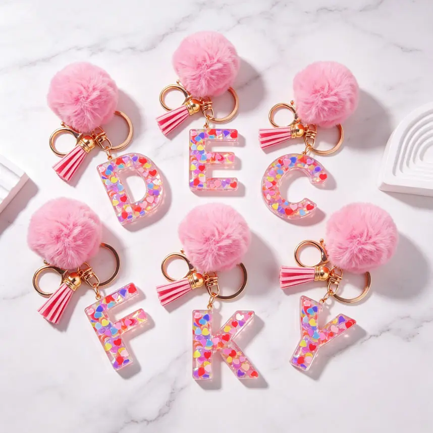 Pink Pom Pom 26 Letter Keychains, Resin Alphabet Key Chains Filled with Heart Glitter, Tassel Crystal Bag Charms. Perfect birthday, holiday and party gifts for friends and family.