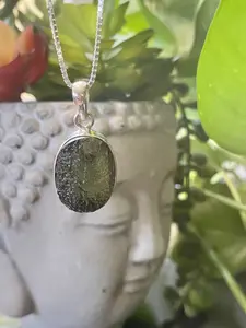 Authentic Moldavite Pendant with Necklace: A 4.7 grams genuine celestial gem, verified for authenticity. Embrace cosmic energies, deepen your spiritual connection, and leap to a transformation journey. Elevate your style and consciousness now.