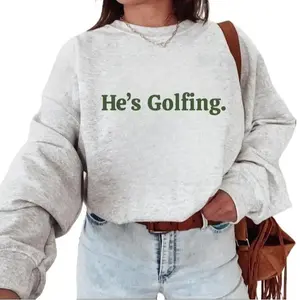 Our "He's Golfing" sweatshirt is a humorous, stylish pick for golf lovers—ideal for wives and girls who golf.