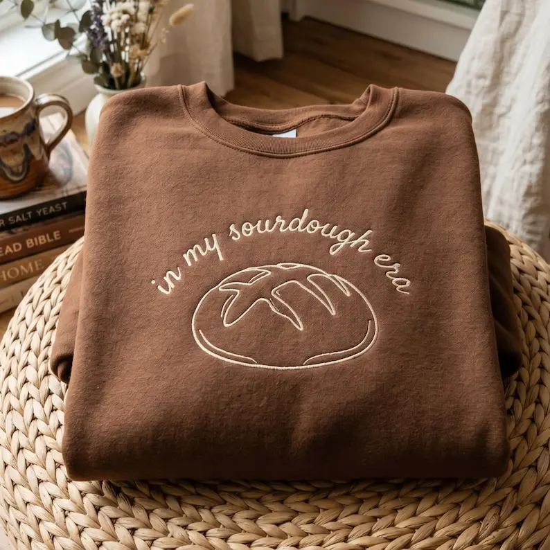 Embroidered In My Sourdough Era Sweatshirt, Brown Cotton Apparel With Cute Loof Of Bread Graphic And Script Text, Baking Lover Clothing