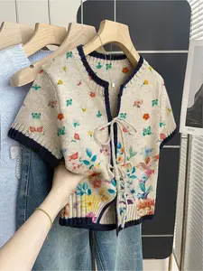 Women's khaki bohemian vacation short-sleeve knit top. Loose round neck, contrast floral print, front tie and contrast piping. Comfortable for spring & summer casual wear Womenswear.