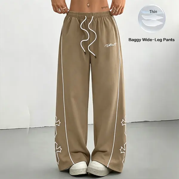 Women’s lightweight athletic pants with a soft, loose fit; gray long pants with a cross print on the side; comfortable, casual sports bottoms for the gym; unisex design.