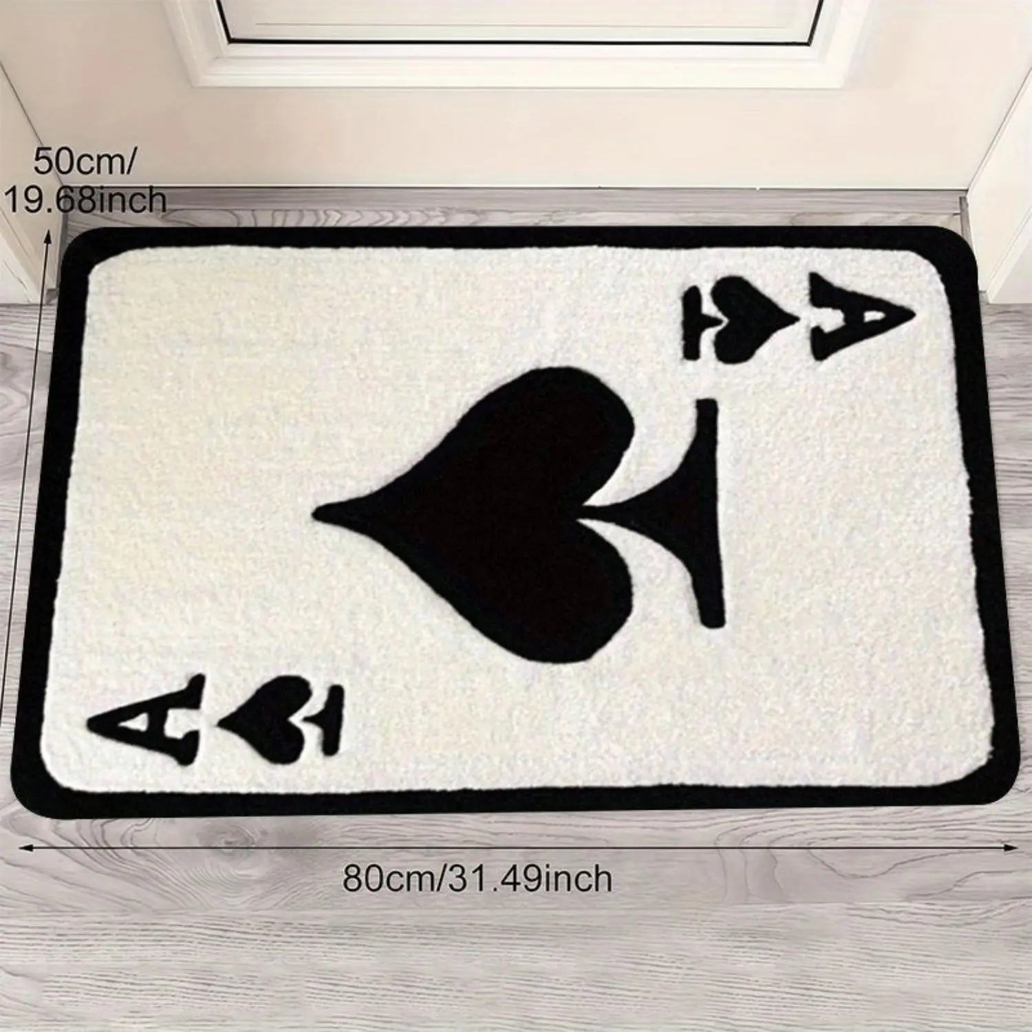 This stylish and creative flannel rug features a black Ace of Spades playing card pattern and is perfect for living rooms, bedrooms, bathrooms, and entryways. It's absorbent, non-slip, and soft and comfortable.