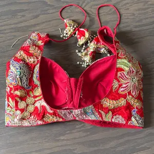 Rajasthani Blouse - Red Embroidered Bralette with Gold Accents and Pearl Detailing for Festive Wear