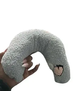 U-Shaped Dog Calming Pillow is designed specifically for small dogs, offering joint relief and improved sleep. This machine washable pet pillow, available in blue, is suitable for both dogs and cats.