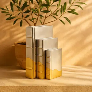 CosmoLiving by Cosmopolitan Set of 3 Silver Faux Leather Metallic Faux Book Storage Decorative Box with Wavy Gold Design