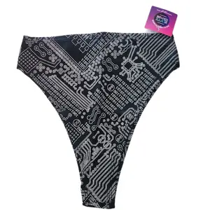 Lyte Couture reflective thong rave bottoms with binary code print.