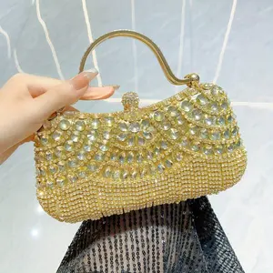 Make a Dazzling Entrance with our Water Diamond Tassel Clutch Bag in Golden or Silvery