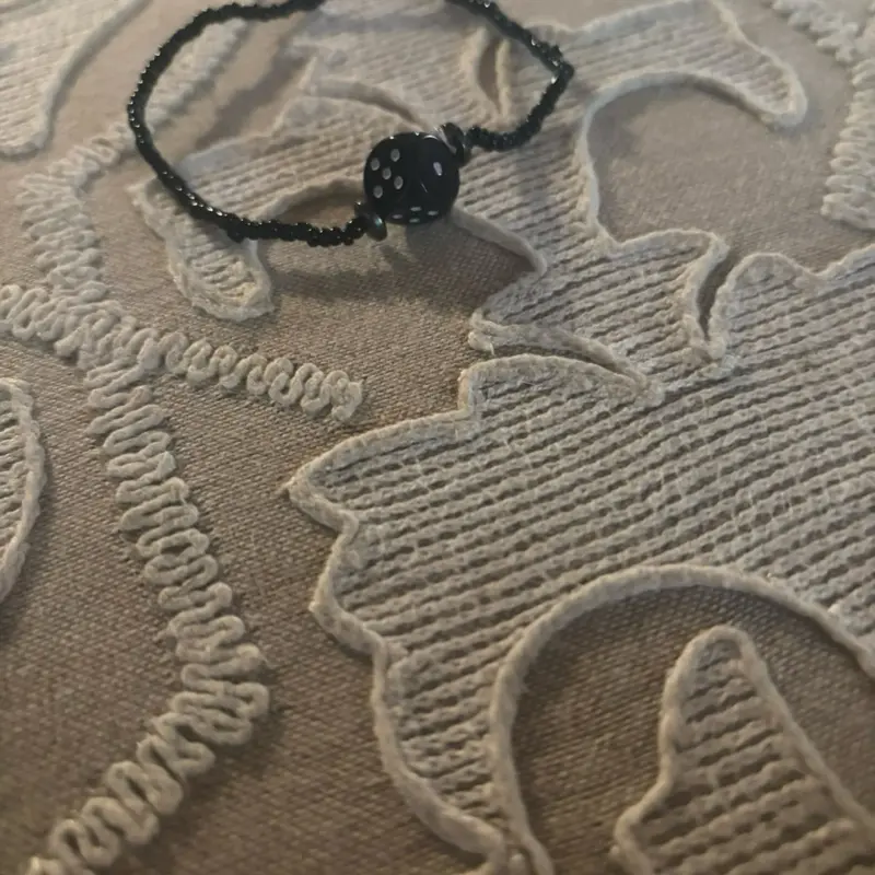 Black Seed Bead Bracelet with Dice Charm - Stylish and Unique Design