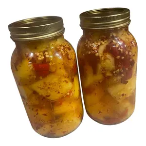 Pickled Pineapple in Mason Jars with Spices and Peppers for Snacking