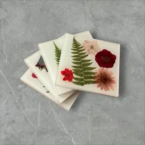 Unique Resin Coasters embedded with real dried flowers nestled against a beautiful white background