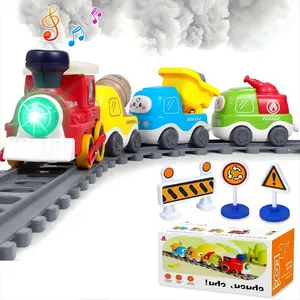 An electric train toy with realistic smoke and sound effects, magnetically connected carriages, DIY tracks, includes 4 construction vehicles and traffic signs, a perfect STEM birthday gift for children aged 3 and up.