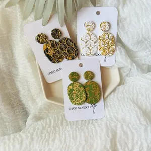 Distressed gold black, olive green, and white clay earrings