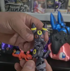 Umbreon Keychains - Gray Creature with Yellow Accents, Unique Design, Ideal for Collectors and Fans
