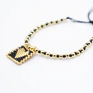 Shmart Bohemian-style Black and Gold Beaded Handmade Heart Charm Bracelet for Good Luck
