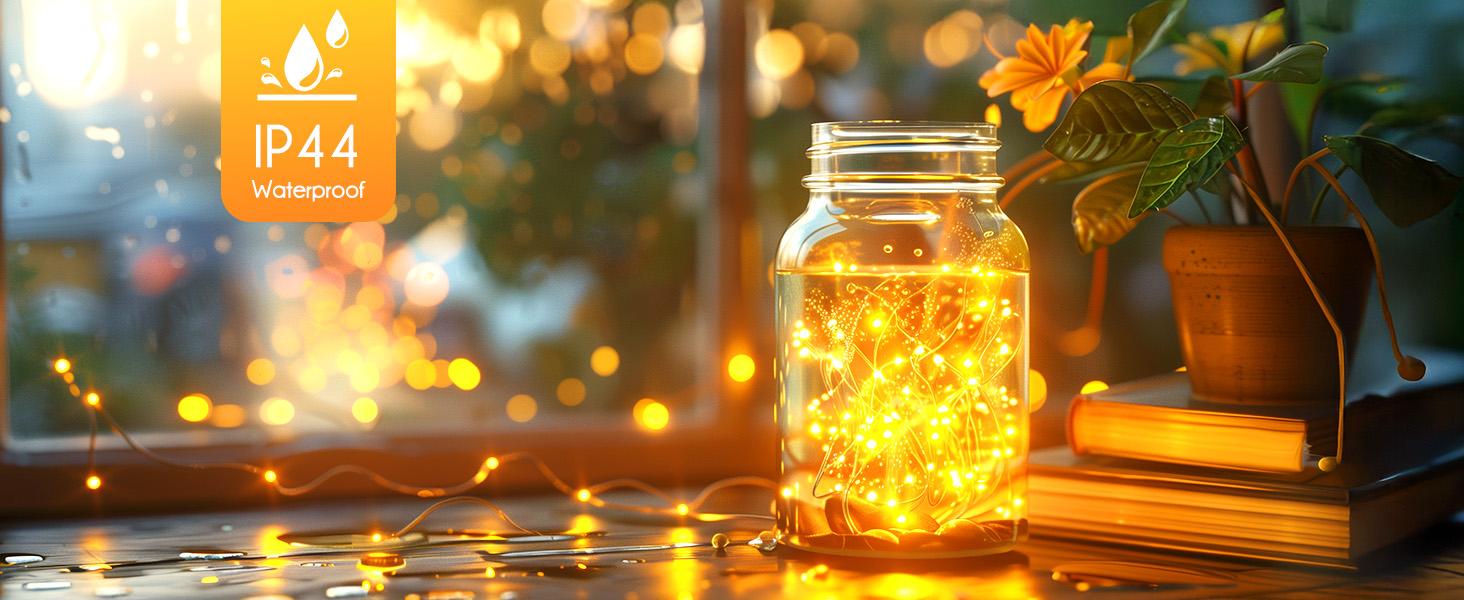 Minetom Fairy Lights Plug in 33Ft 100 LEDs Waterproof Silver Wire Firefly Lights Adaptor Included Starry String Lights for Wedding Indoor Outdoor Christmas Patio Garden Decoration Warm White