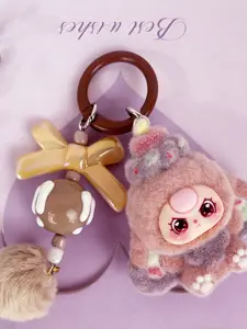 A cute pendant featuring a multi-colored plush doll as the main element, paired with a bow and pom-pom, with a sweet and dreamy style. It is suitable for hanging on bags or keys, adding a girlish and lively atmosphere to everyday outings, dates, and gathe