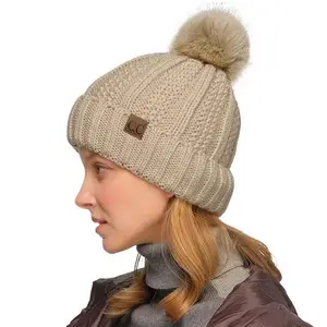 C.C Fuzzy Lined Beanie with Faux Fur Pom for Women casual knit hat Women's Faux Fur Pom Beanie
