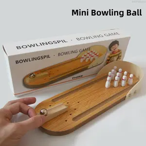 Solid wood mini bowling tabletop game, creative puzzle toy for kids. Enjoy fun ball rolling games, great for interactive parent-child leisure time.