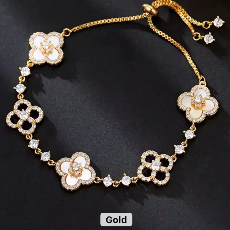 Gold Clover Bracelet - Elegant Design with Floral Motifs and Sparkling Details