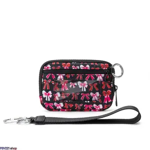 Bow Print Iris Mini RFID-Blocking Wristlet Wallet. Practical ID and card holder with zipper closure, solid key ring and detachable wrist strap. Compact, portable and stylish, great for travel, outdoor activities and daily casual use.