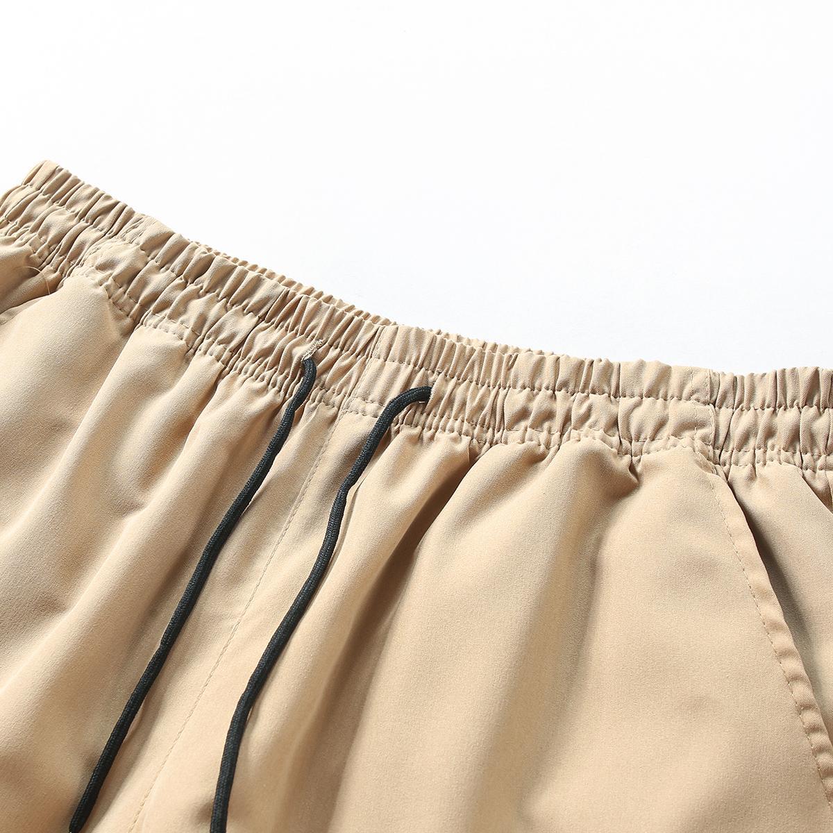 Men’s cargo shorts, solid color; outdoor tactical shorts; summer casual athletic shorts; loose fit with multiple pockets and an elastic waistband for work and hiking; suitable for outdoor hiking, everyday running, and commuting outfits.