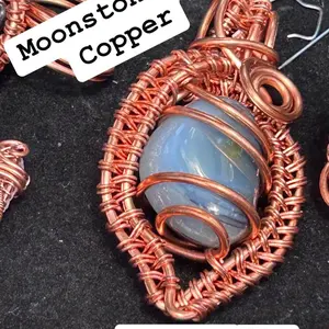 Moonstone stone wrapped in copper