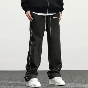 Men’s Black Wide-Leg Track Pants with White Side Stripes, Perfect for Retro Streetwear, Clean Casual Fits and Elevating Everyday Basics.