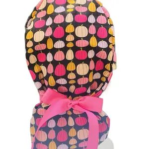 Pink pumpkins in black scrub cap
