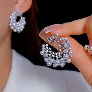A pair of ring-shaped fashion earrings
