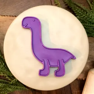 Heavy Chewer Dog Toy - BPA Free - Cheese flavored - Long Lasting - Indestructible - Decker's Dog Supplies Decker's Dino (Purple)