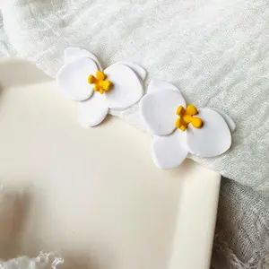 Large white orchid clay studs