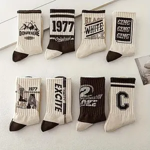 5 pairs of men's retro inspired socks vintage letter patterns neutral earth tones comfortable athletic fit perfect for outdoor activities basketball sports durable knit fabric for long lasting wear
