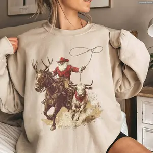 Cowboy Santa Western Roping Christmas Shirt, Vintage Country Sweater, Howdy T-shirt, Cowgirl Gift Wrangling Santa Hoodie , Global Trending Outfits