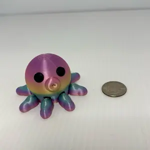3D printed articulated octopus figure with black eyes