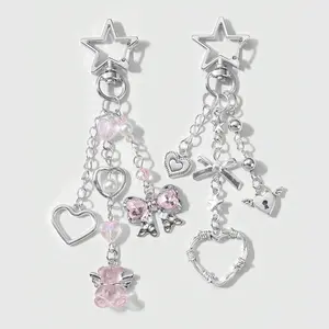 Set of 2 fashionable, sweet, cute, light luxury silver keychains/bag charms featuring heart motifs, rhinestones, bows, and a small crystal bear—heart-themed design. Suitable for sisters and best friends’ everyday wear; ideal as holiday gifts.