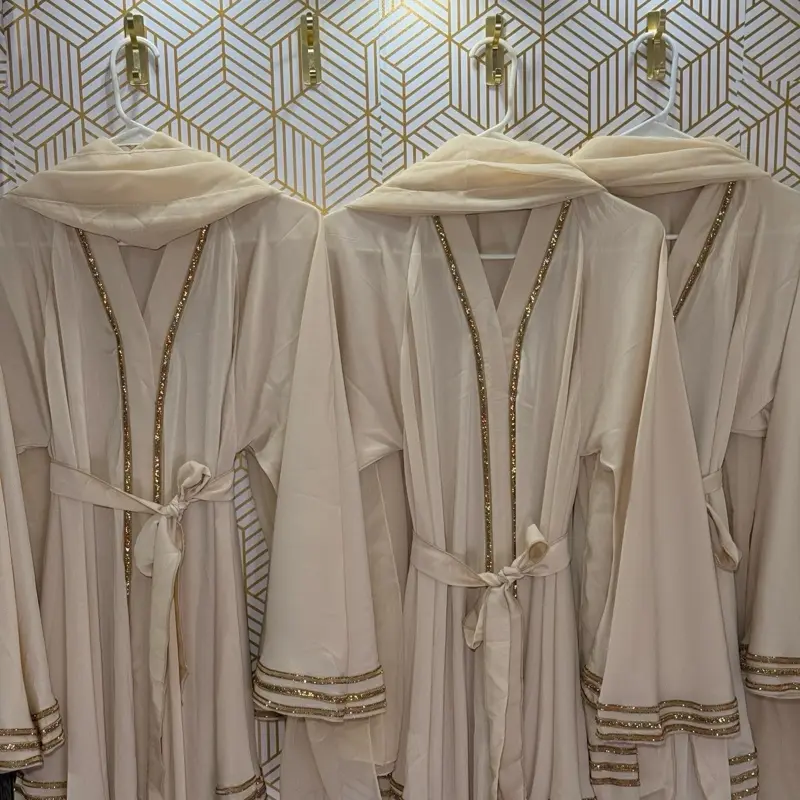 Cream Flowy One Piece Abaya with Gold Detailing Including Hijab for Stylish Comfort