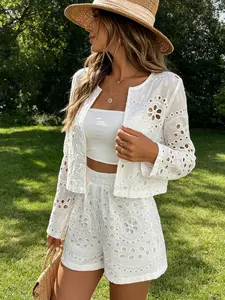 Two piece women's fashionable white hollow embroidery jacket and shorts set, with fresh and breathable hollow embroidery. The short version looks tall and slim, making it easy to wear for commuting and shopping
