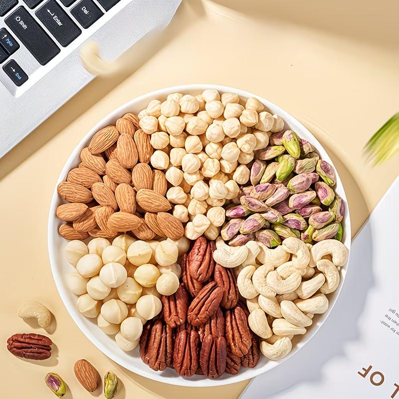 Mixed nut pieces (hazelnut, almond, cashews, walnut, dried grapes, dried cranberries); gluten-free snack; energy boost before and after workouts; low sugar, high protein; crunchy and tasty; individual small packaging for office snacks.