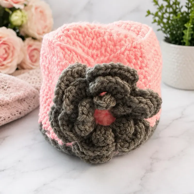Handmade crochet hat with flower appliqué