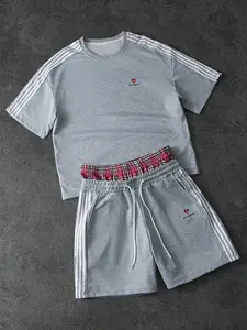 This men's casual sportswear two-piece set Sweatsuit Set includes a crew neck short-sleeved T-shirt and an elastic waist drawstring shorts. The relaxed fit makes it a suitable holiday gift.