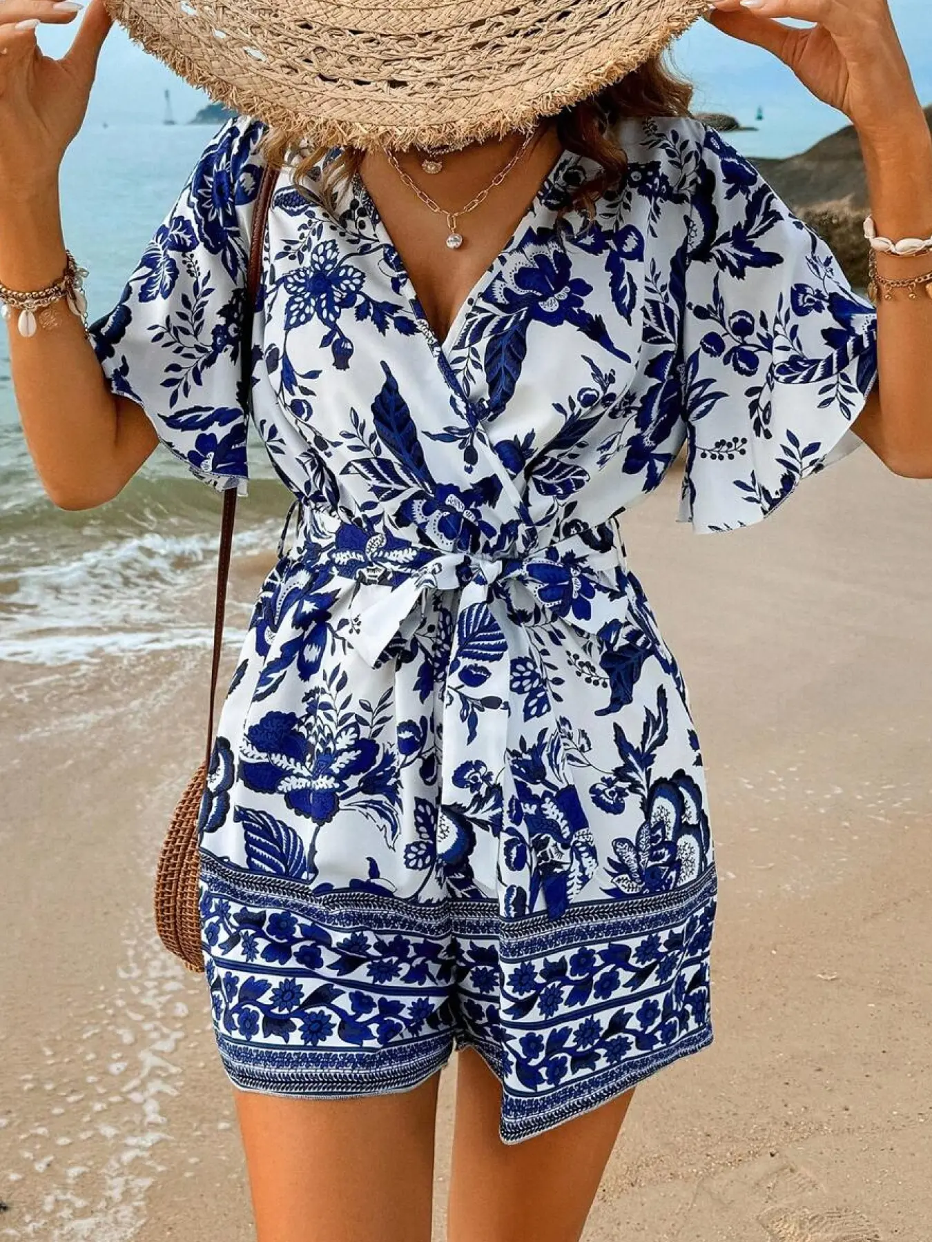 A women's dress, Bohemian casual dress, Boho Casual Fashion, with a red base and small white floral prints, featuring a V-neck, cinched waist, and slightly puffed mid-length sleeves, short style, suitable for everyday outings, dates, Boho Styles Fashion