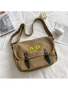 1PC niche design retro crossbody bag, AD logo canvas messenger bag, yellow color-blocking design with brand elements, made of premium canvas material, soft to the touch and highly durable.