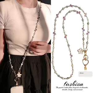 The new fashion cross-body pearl crystal phone chain is a long, forest-inspired, fresh, sweet, and high-end accessory, perfect for birthday gifts, Crossbody Phone Lanyard