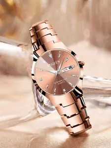 A ladies' watch with a rose gold-toned steel bracelet, exuding light luxury, elegance, and refined style. It features sparkling diamond accents, high-end aesthetics, and sleek lines, with a day-date quartz movement. Elegant Fashion Watch